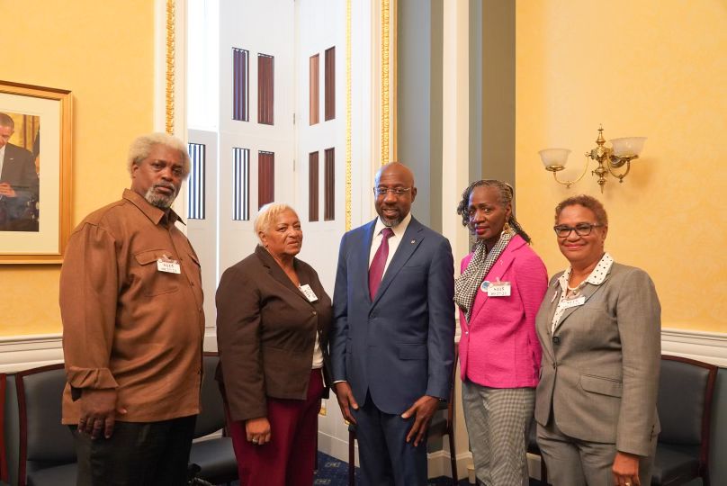 Clery Center board chair Sheilah Vance (far right) and parents of children who were killed or seriously injured by hazing with U.S. Senator Raphael Warnock (center), September 2023.